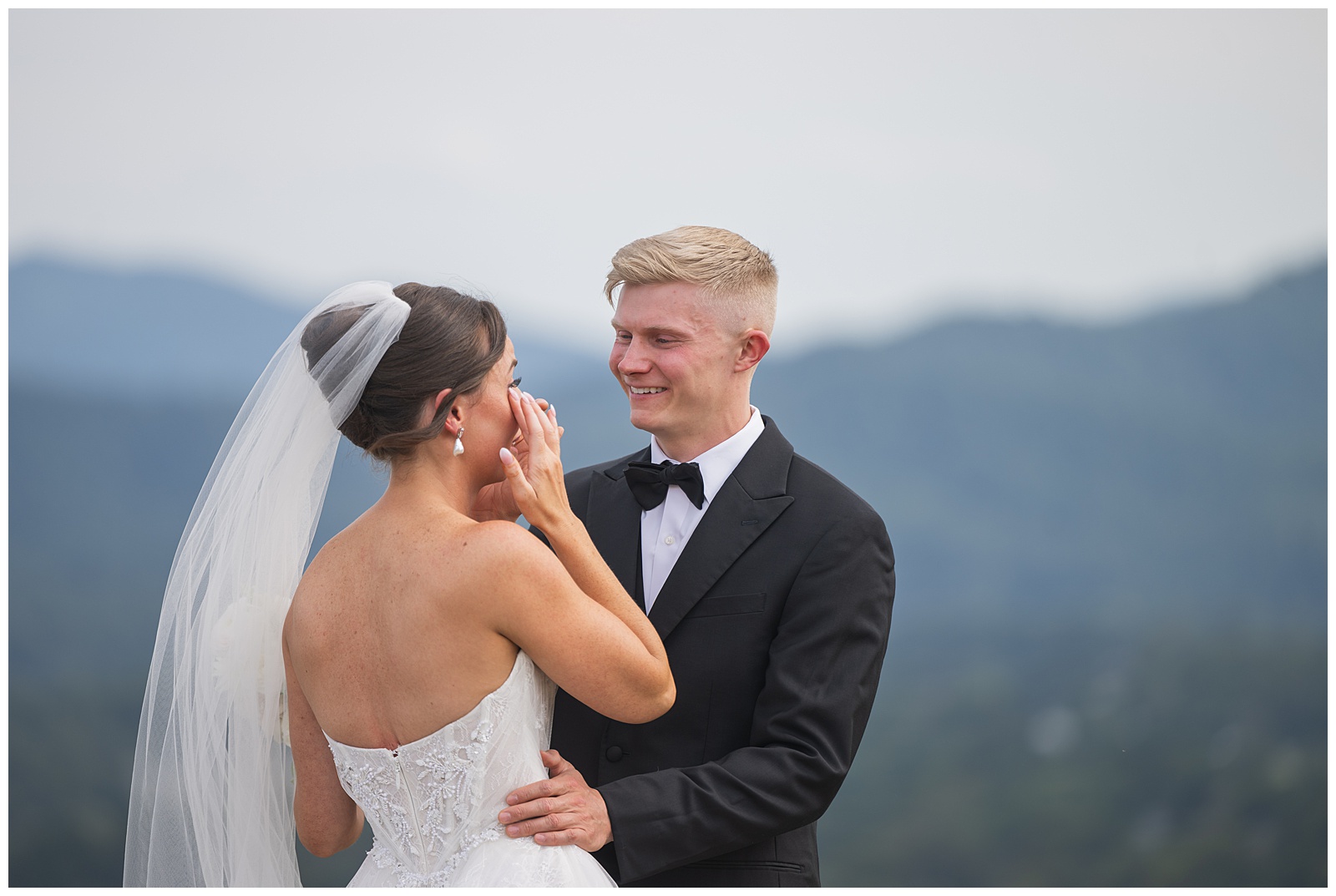 Husband at First Look with his crying wife in Veritas Vineyards by Amberlee Christey Wedding Photographer